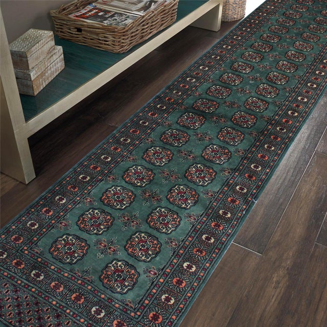Transform the interior of your home with a beautiful hand-knotted Bokhara rug. Meticulously crafted with intricate...
