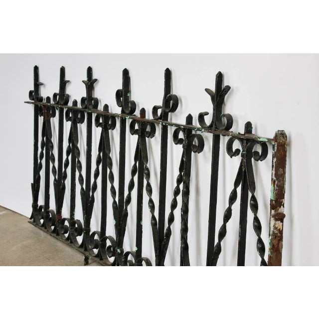 Rustic 19th century French fence railing fragment constructed from wrought iron. Beautifully handcrafted with twisted,...