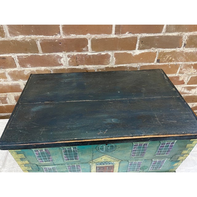 This unique item is an antique English folk art painted box or chest. The exterior is hand-painted with a Georgian style...