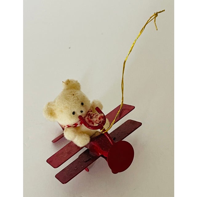 Vintage metal aero plane with plush toy teddy bear as Christmas Ornament.