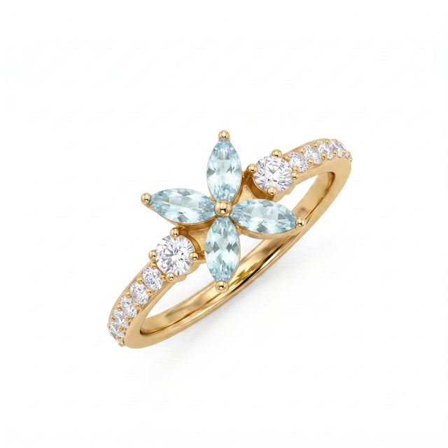 This ethereal ring captures a soft, serene beauty with its light blue, aquamarine-toned floral design. Featuring the same...