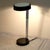 1970s Black Chrome Round Desk Lamp by Lightolier. Adjustible spine, switch on the base,.