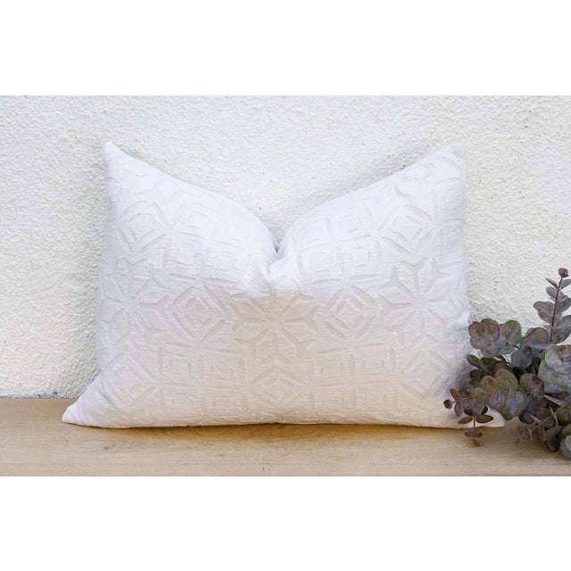 This decorative pillow cover features beautiful array of patterns, with hand crafted appliqué cut work, giving it a...