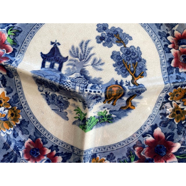This is certainly a beautiful transferware divider plate made around the early 1900's in the UK. I love the addition of...