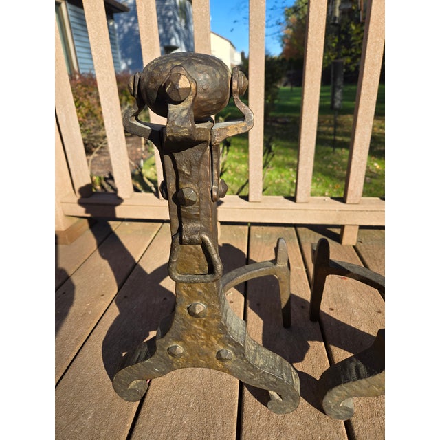 Vintage cast iron andirons aka firedogs. Approximately 18" tall x 11" wide x 10" deep.