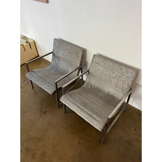 Pair of sculptural lounge chairs in the manner of Hans-Ullrich Bitsch. Continuous woven metal mesh seats and backs over...