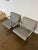 Pair of sculptural lounge chairs in the manner of Hans-Ullrich Bitsch. Continuous woven metal mesh seats and backs over...