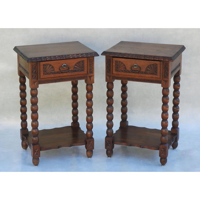 A charming and increasingly rare pair of Neo-Basque side tables or nightstands, dating from the 1930s, France. Crafted in...