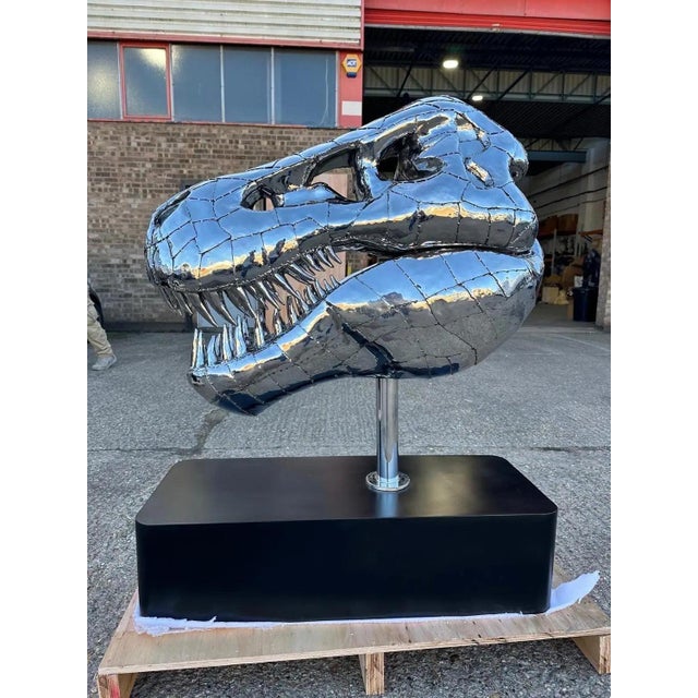 This stunning stainless steel Tyrannosaurus Rex sculpture captures the fierce majesty of the prehistoric predator. Crafted...