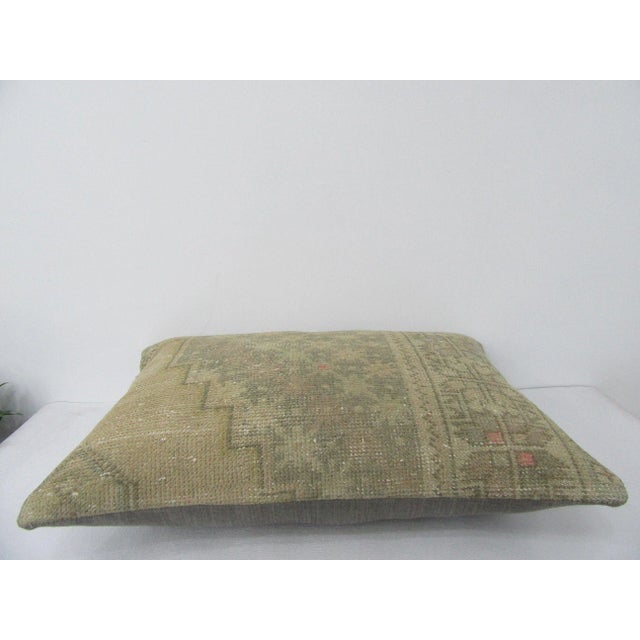 Decorative pillow cover made from a vintage Turkish handknotted rug. Backed with good quality cotton fabric. Pillow...