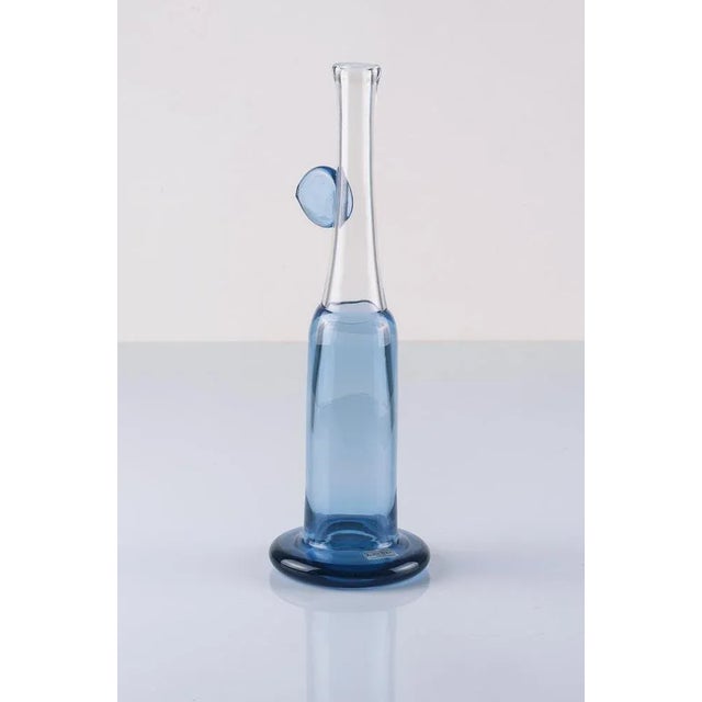 Beautiful tall vase by Bertil Vallien for Kosta Boda, Sweden. Etched signature and label. This piece has an attribution...