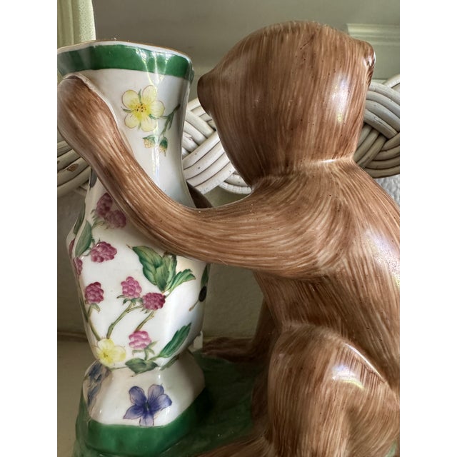 Incredible, Antique pair of early export Chinoiserie ceramic monkey vase/candlestick holders. They features a hand-painted...