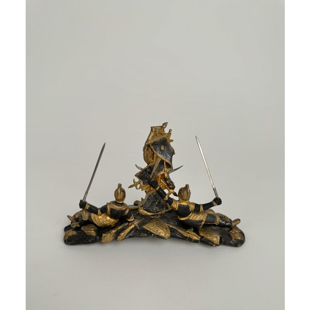 Gilt & Patinated Bronze Sculpture of Two Soldiers A decorative sculpture depicting multiple warriors in a dynamic...