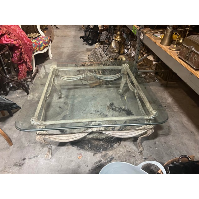 Up for consideration is a beautiful singular French metal white coffee table with a glass top. This would look lovely in...