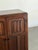W34 D17 H48 This vintage oak armoire features carved panel doors with geometric detailing, original hardware, and a warm...