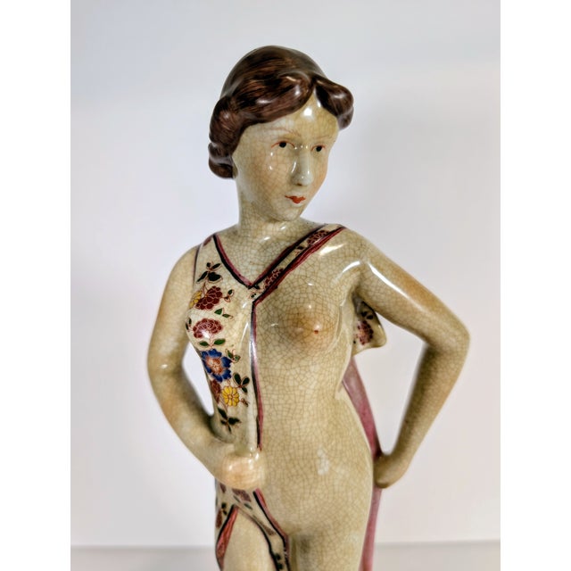 This Rare Porcelain Art Deco Nude Figural Statue from the 1940's exudes elegance and artistry. I have extensively searched...