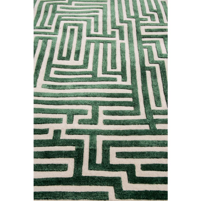 Walk the maze with the Anatolia geometric handmade rug design, named after the birthplace of the ancient word for...