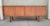 Hans Wegner RY-26 teak Danish Modern credenza with sliding doors and fitted interior. Features 6 interior shelves, 5 being...