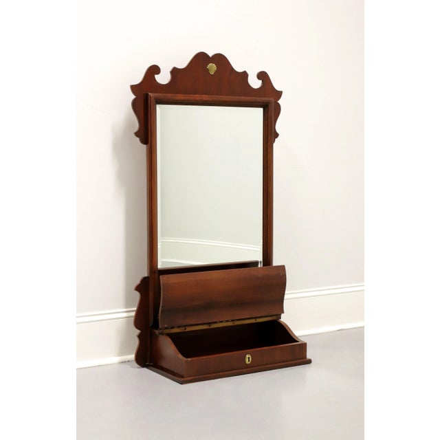 A Chippendale style dressing table mirror by Lexington Furniture. Beveled mirrored glass, portrait oriented, decoratively...