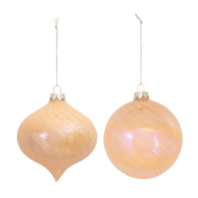 Enhance your holiday decor with the beauty of these Iridescent Glass Ornaments. This collection of ornaments features a...