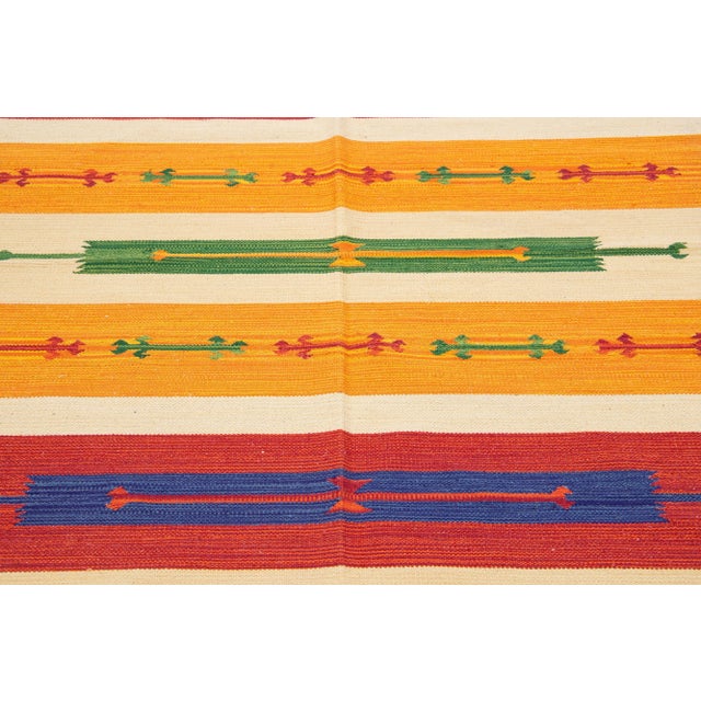 Beautiful Modern Kilim hand-knotted wool rug with multicolor accents in an all-over geometric design. This rug measures...