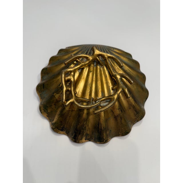 Crafted from heavy, solid brass, this beautifully sculpted piece features a deeply ridged fluted scallop shell design....