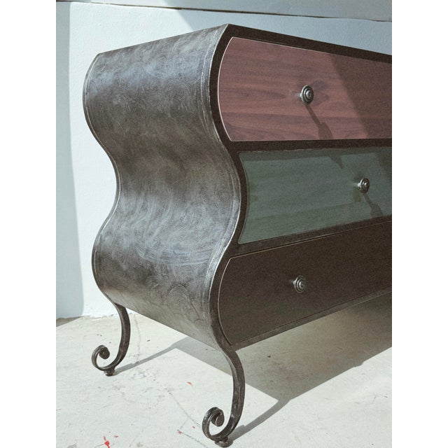 Whimsical wavy metal dresser with swirl feet. Green, pink ish, and blue laminate drawers and top. A fun statement piece!...