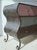 Whimsical wavy metal dresser with swirl feet. Green, pink ish, and blue laminate drawers and top. A fun statement piece!...
