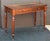 A fine English writing table or desk or side table of mahogany from the late Georgian Era, featuring a moulded rectangular...