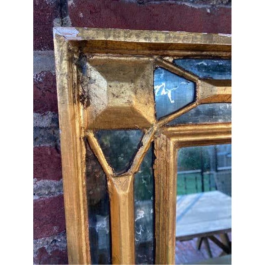 Italian Giltwood Wall Mirror with a step back base. Dramatic Mirror with a lattice and mirror edge design. Shows nice...