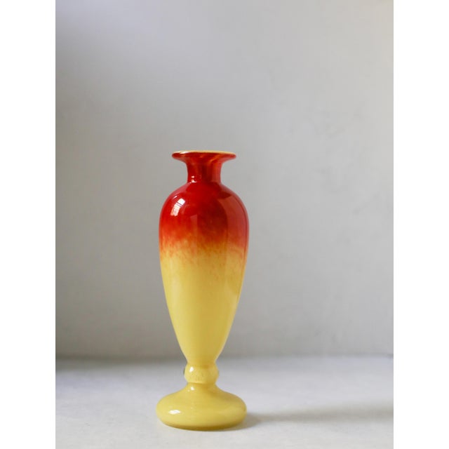 A striking signed French Art Deco art glass vase by Schneider, dating to the 1920s. This elegant elongated form features a...
