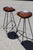 An amazing pair of barstools attributed to Gretta Grossman. These fine pieces are comprised of black iron frames with...