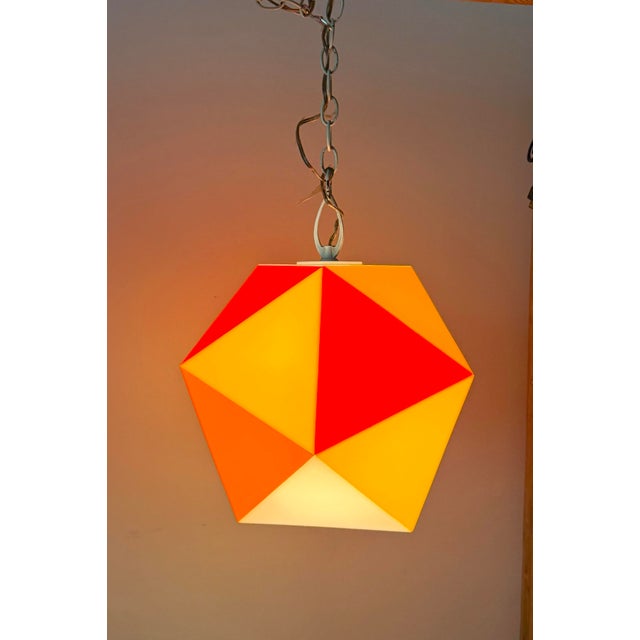 Designed by Fredrick Ramond in 1963, this striking geometric pendant light is a wonderful example of the playful optimism...