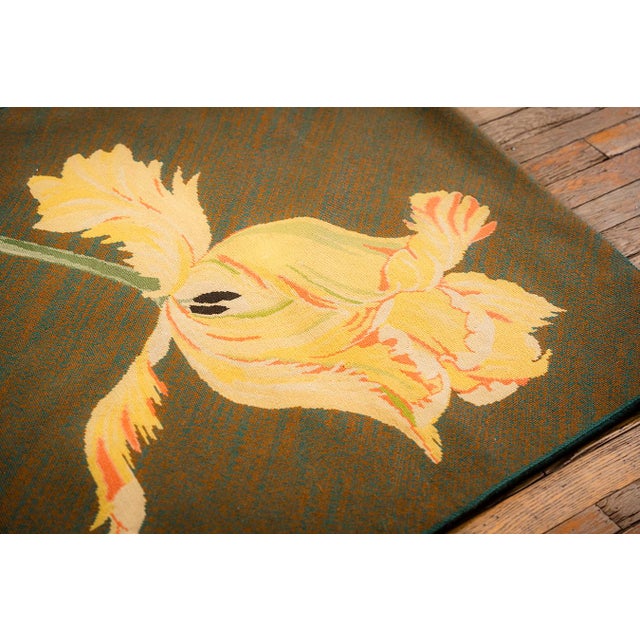 This elegant Antique English Needlepoint rug, dating to circa 1900, is a classic example of turn-of-the-century...