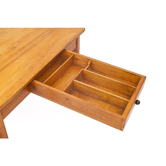 Set of gold and massive chestnut meals. A table and 4 chairs. Attributed to Charlotte Perriand, for "Les Arcs". Large...