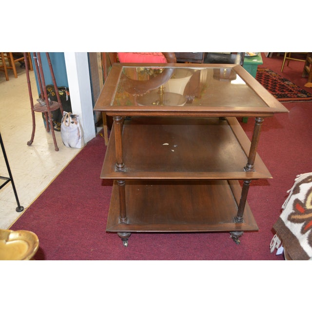 Vintage wooden table / tea cart on castors! The top has removable glass. Pretty columns at the corners. A very versatile...