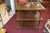 Vintage wooden table / tea cart on castors! The top has removable glass. Pretty columns at the corners. A very versatile...