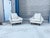 Sculptural Mid-Century Modern Lounge Chairs This striking pair of mid-century modern lounge chairs showcases a beautifully...