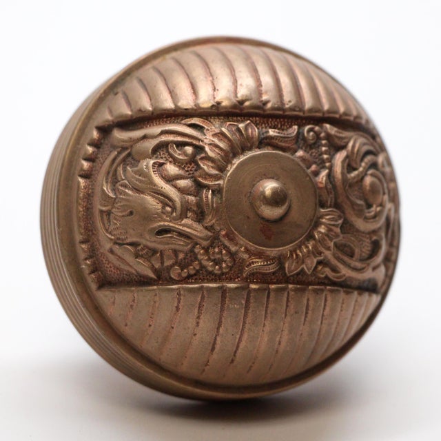 This Italian Renaissance style asymmetrical bronze entry door knob was made by Reading in 1894 catalog. It is part of the...
