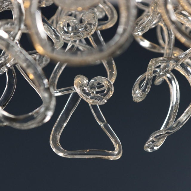 Ceiling lamps from the 'Giogali' series with transparent Murano glass pendants woven around a chromed metal frame....