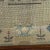 DETAILS An antique framed, rectangular needlework sampler with four rows of block alphabets in upper and lower case and...