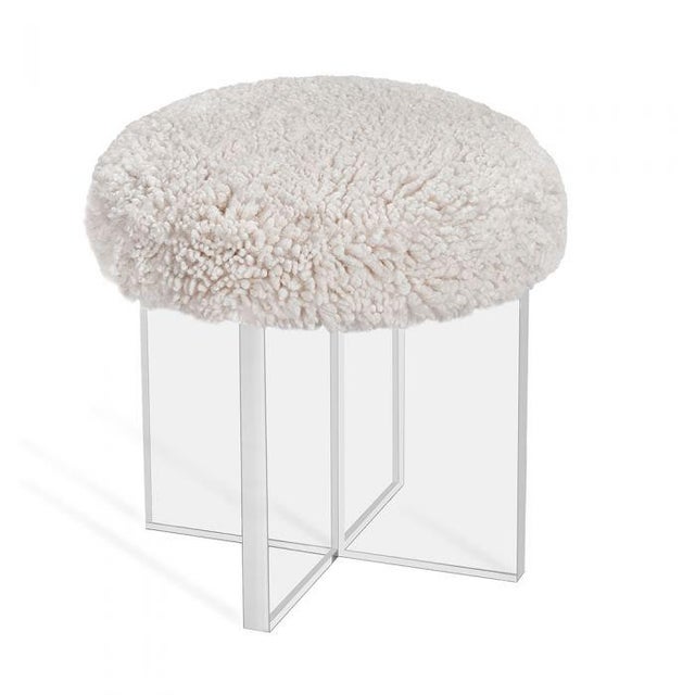 The Jules Stool redefines modern elegance by combining a sleek, angular, clear acrylic cross base with the cozy, inviting...