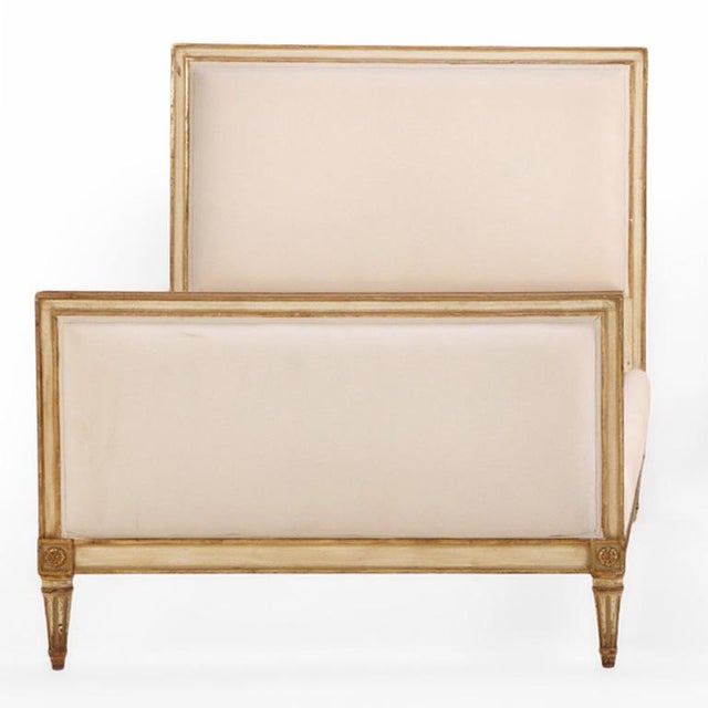 This frame features a refined square head and footboards highlighted with giltwood accents, adding an elegance to the...