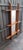 Mirror in the shape of a Swedish painting with a wooden frame that, when viewed from the front, is deliberately elongated...
