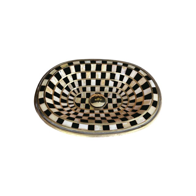 Elevate your bathroom with this stunning handcrafted brass and resin vessel sink, designed to transform any space into a...