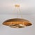 Modern, pared-down form language is brought to life through the unique materiality of Oaklyn. A Vintage Gold Leaf trough...