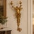 Add dramatic French elegance to your walls with this ornate Rococo-style cherub wall sconce, featuring a sculptural winged...