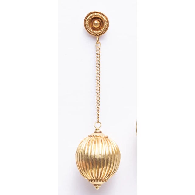 22K gold melon-ribbed bead drop earrings with gold chain and post for pierced ears. By Deborah Lockhart Phillips. The fine...