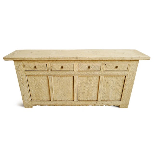 Vintage hand carved old solid wood sideboard with bleached finish. Features four top drawers and four doors below opening...