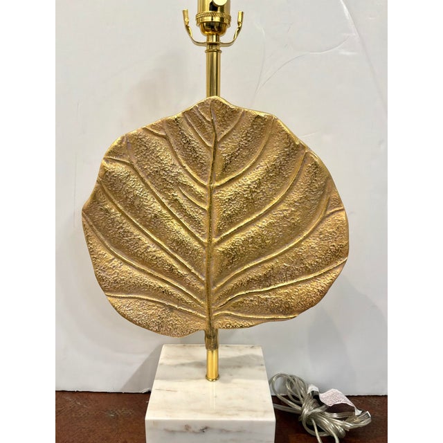 John Richard Modern Lamp. Gold leaf shaped body on marble base. Showroom floor sample.